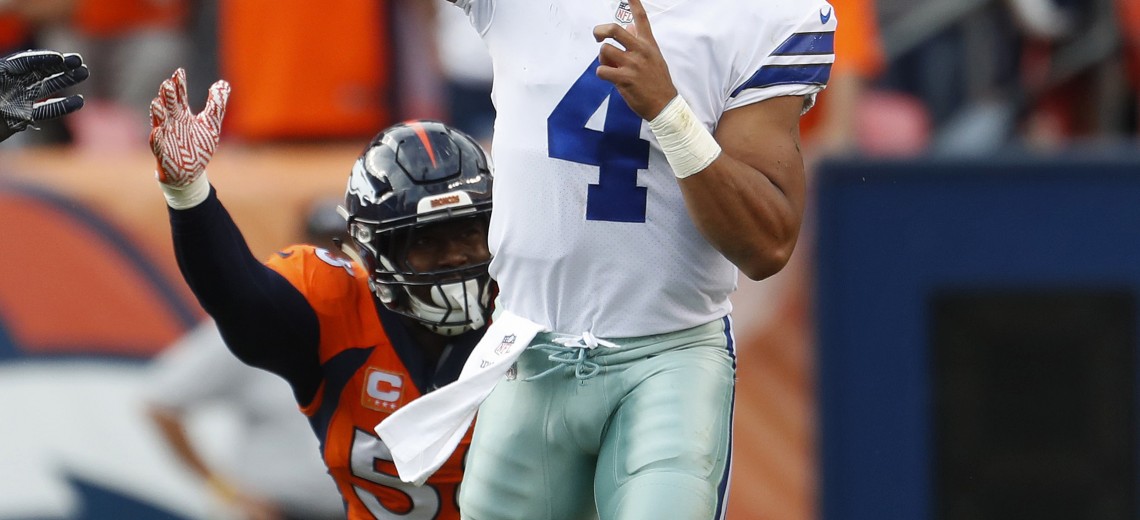 Dallas Cowboys quarterback Dak Prescott(4) throws as Denver Broncos outside linebacker Von Miller pursues during the second half of an NFL football game, Sunday, Sept. 17, 2017, in Denver. (AP Photo/Joe Mahoney)