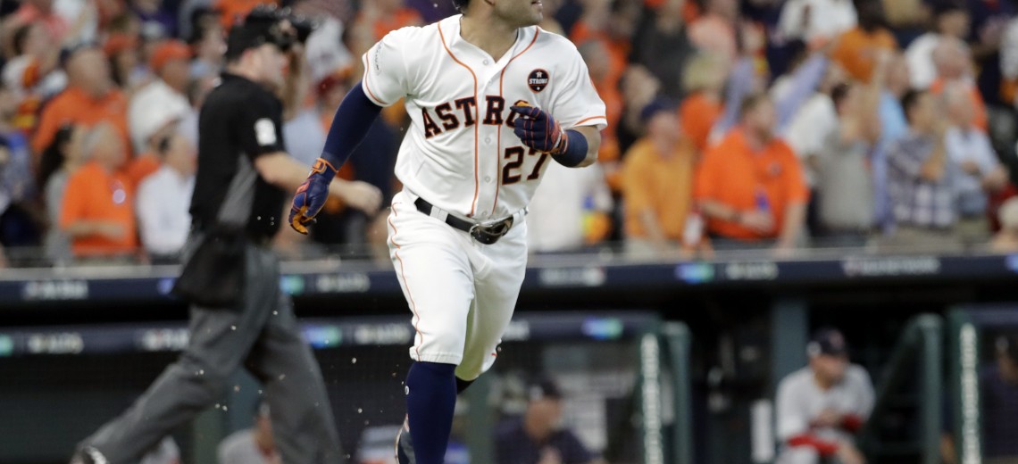 Houston Astros' Jose Altuve (27) watches his home run clear the fence during the first inning in Game 1 of baseball's American League Division Series against the Boston Red Sox, Thursday, Oct. 5, 2017, in Houston. (AP Photo/David J. Phillip)