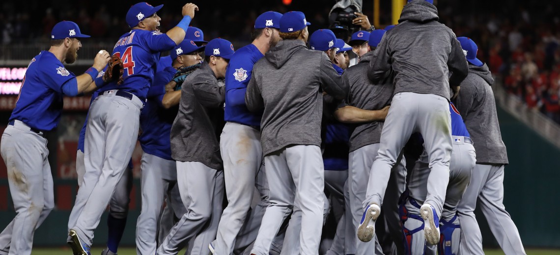 The Chicago Cubs celebrate after beating the Washington Nationals 9-8 to to win baseball's National League Division Series, at Nationals Park, early Friday, Oct. 13, 2017, in Washington. (AP Photo/Pablo Martinez Monsivais)