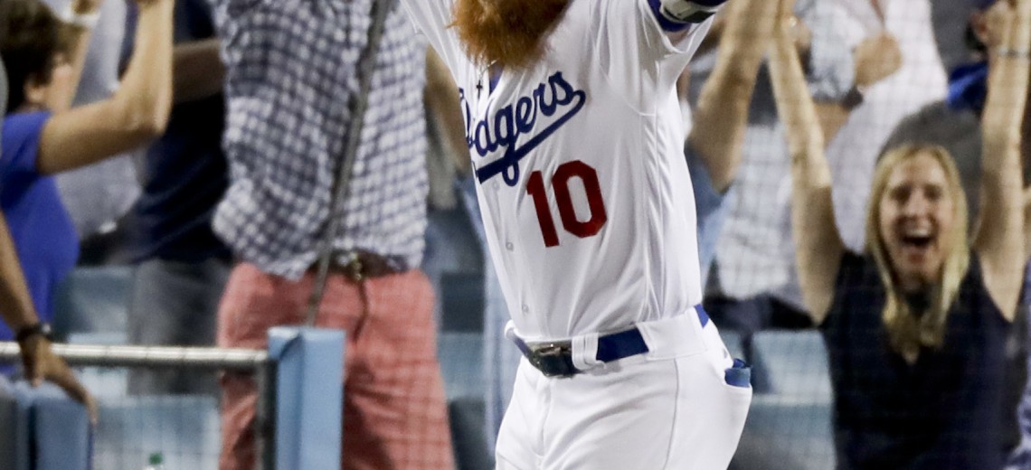 Los Angeles Dodgers' Justin Turner celebrates after a three-run walk off home run against the Chicago Cubs during the ninth inning of Game 2 of baseball's National League Championship Series in Los Angeles, Sunday, Oct. 15, 2017. The Dodgers won, 4-1. (AP Photo/Alex Gallardo)