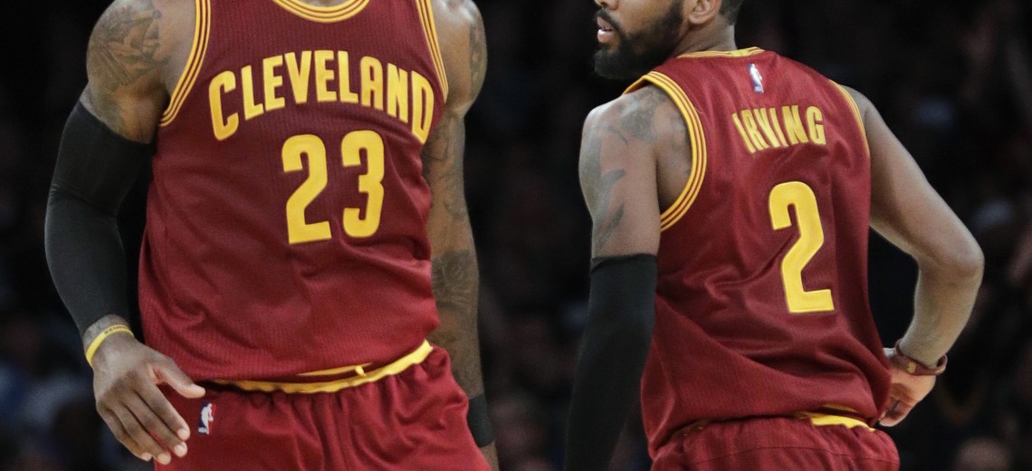 FILE - In this March 19, 2017, file photo, Cleveland Cavaliers' LeBron James, left, greets Kyrie Irving during the second half of an NBA basketball game against the Los Angeles Lakers in Los Angeles. Irving was traded to the Bostons Celtics and returns to Cleveland to play against the Cavaliers, on Tuesday, Oct. 17. (AP Photo/Jae C. Hong, File)