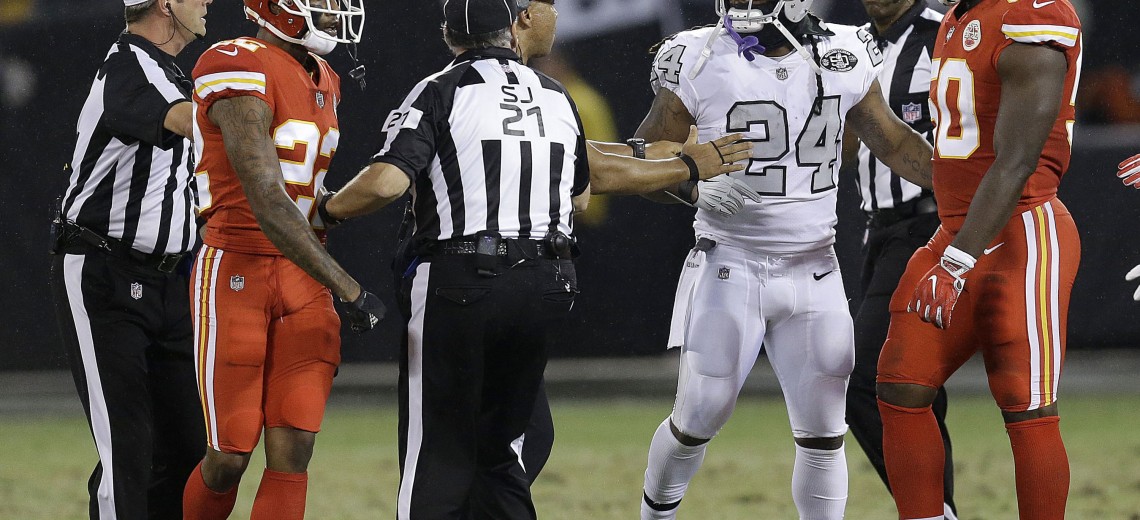 Oakland Raiders running back Marshawn Lynch (24) talks with officials before he was ejected during the first half of an NFL football game between the Raiders and the Kansas City Chiefs in Oakland, Calif., Thursday, Oct. 19, 2017. (AP Photo/Ben Margot)
